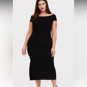 Black sweater trumpet midi dress.